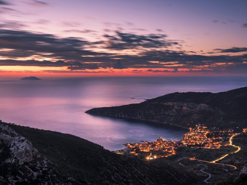 Amazing panoramic shot of the Komiza town facing the Adriatic Sea from Island Vis in Croatia